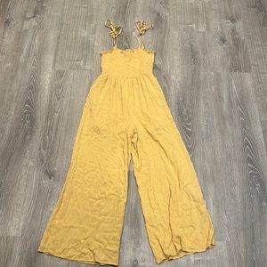 Francesca’s gold jumpsuit